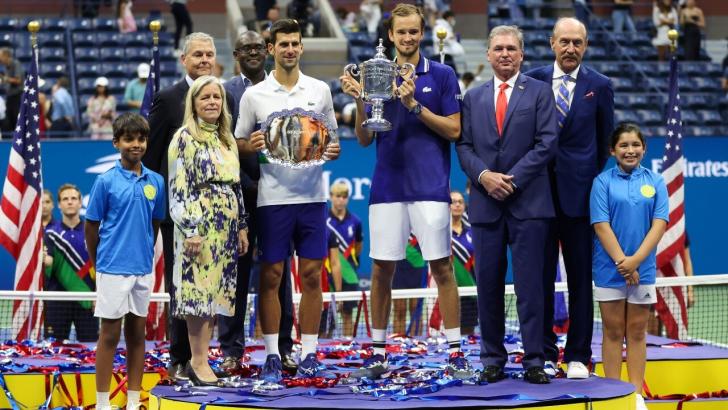 Defending champion Daniil Medvedev holds aloft the trophy in 2021